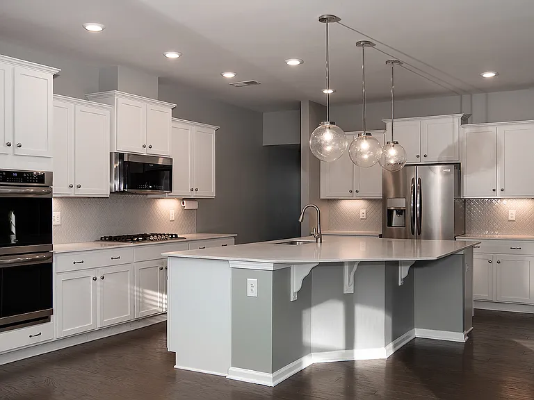Kitchen with large island and double ovens