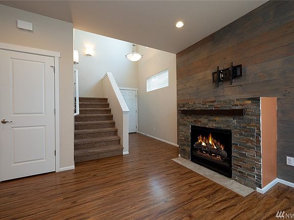 Beautiful family room with gas fireplace. TV mount already in place for your enjoyment