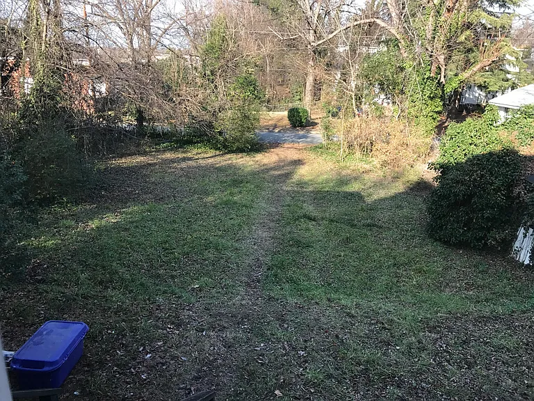Large back lot opens to Bessemer Avenue. Lots of parking and more.