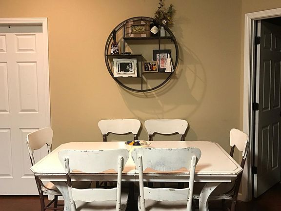The dining area is large enough to accommodate a large farmhouse-style table and 6 chairs.