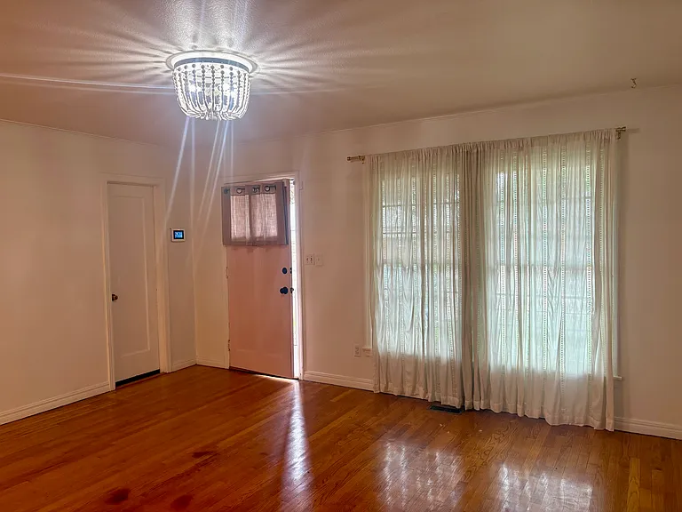 Sunny living room with updated fixture.