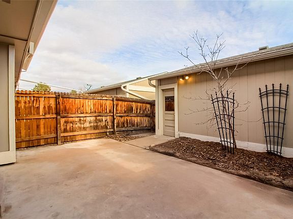 Back yard between 2 car garage and the house