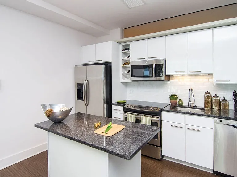 Kitchen with granite countertops and stainless steel appliances