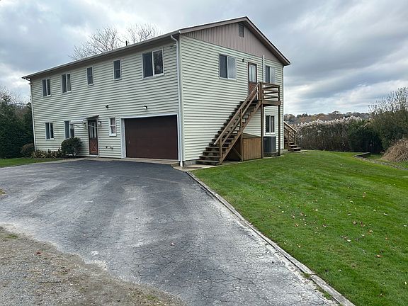 Stairwell inside and outside - Outside leads directly to a foyer off living area