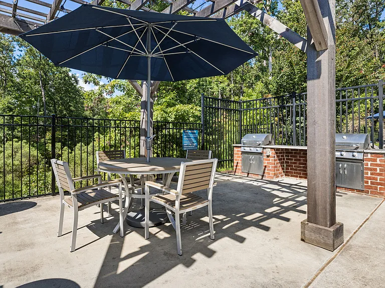 Outdoor Community Grilling Station with Picnic Table and Umbrella