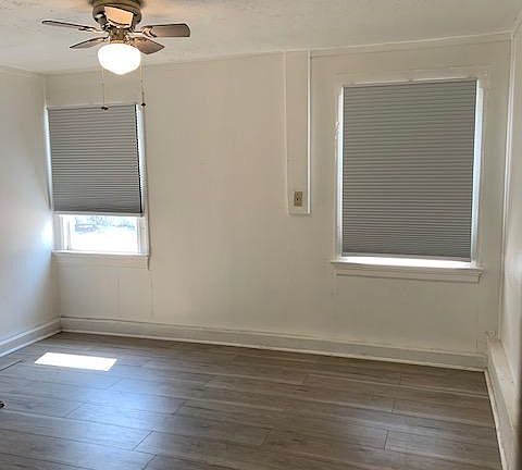 Master bedroom with a fan, new windows and new blinds in all rooms