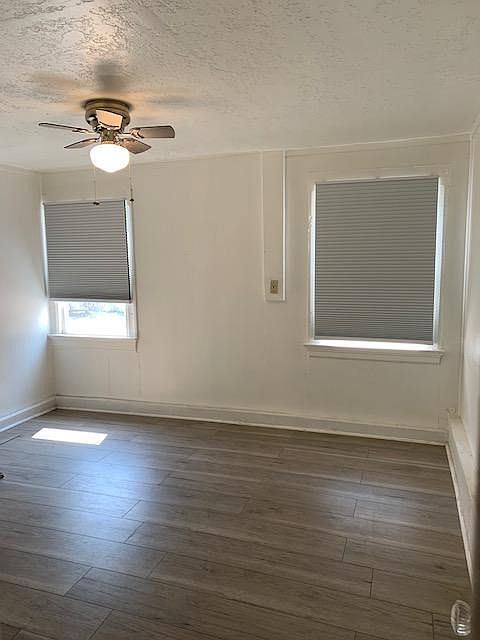 Master bedroom with a fan, new windows and new blinds in all rooms