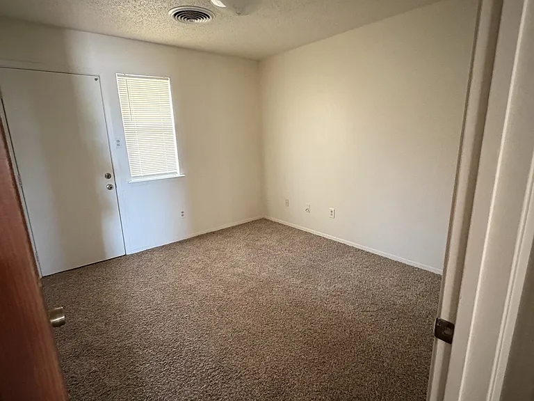 Bedroom #2 with door to backyard