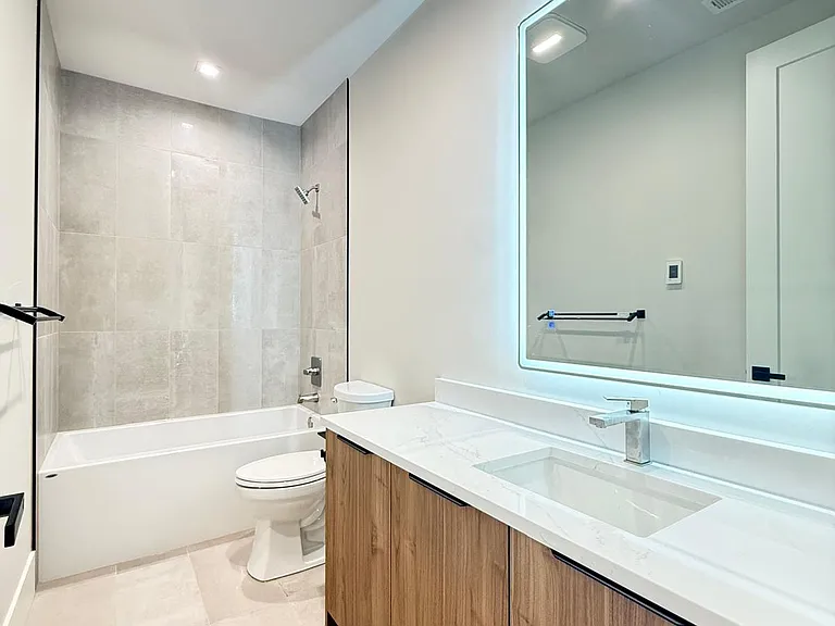 spacious full bathroom with heated floor