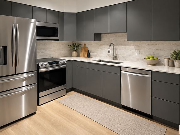Remodeled kitchen with Samsung appliances, granite countertops, Kohler sink and faucet