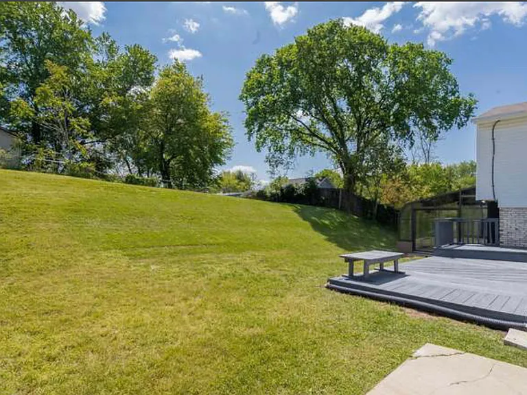 Spacious backyard. Perfect for backyard movie nights.