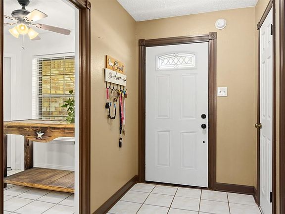 As you enter this charming home the kitchen is off to your right and the secondary bedrooms are to the left