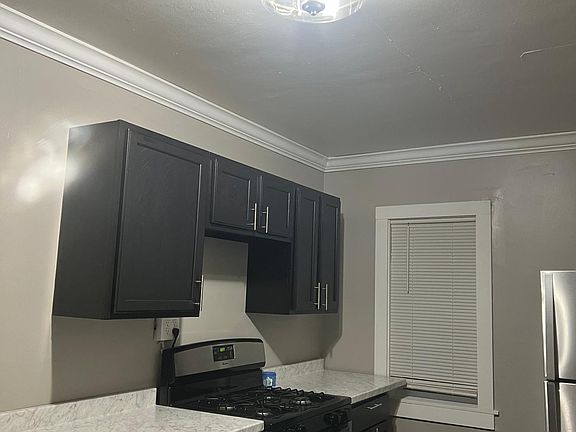 Shows new light and additional cabinetry.