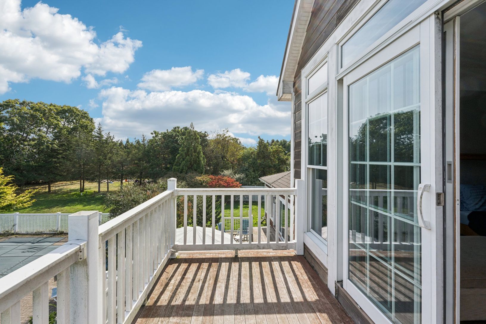The primary bedroom opens to a private balcony offering sweeping views.