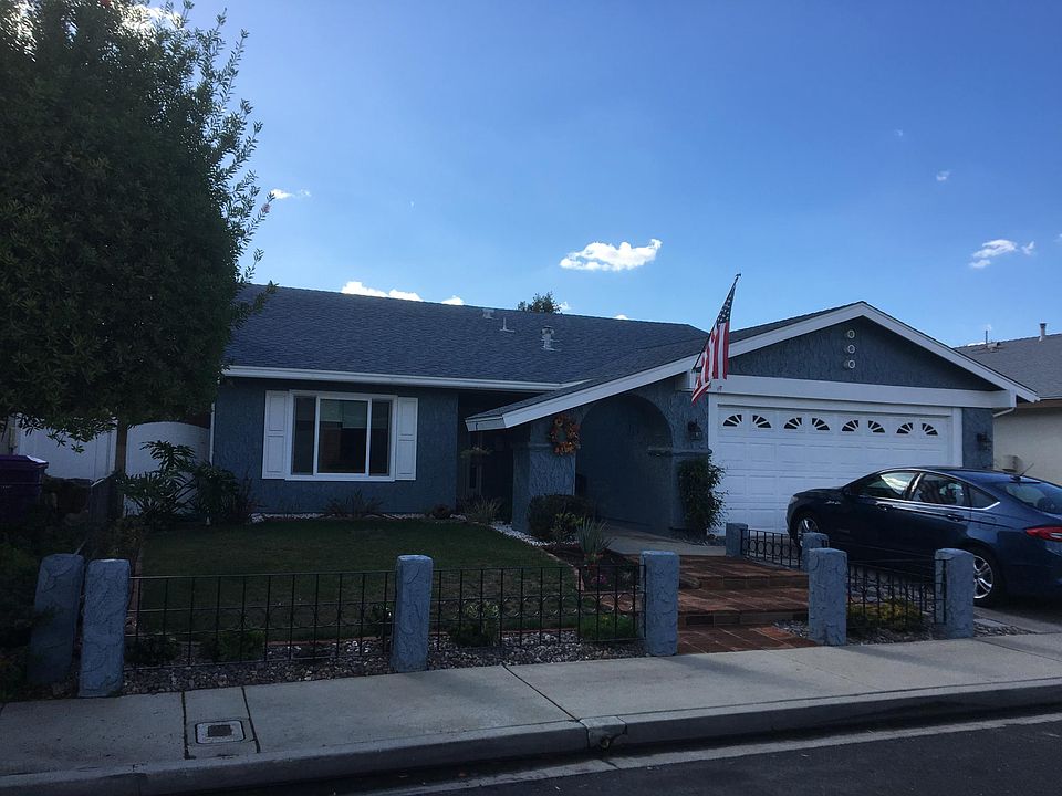 Deep entry door with 2 sidelines and 2 large car attached garage.