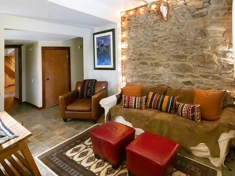 Lower family/game room with TV and full bathroom