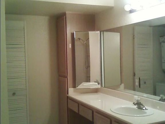 Bathroom view of sink, cabinets