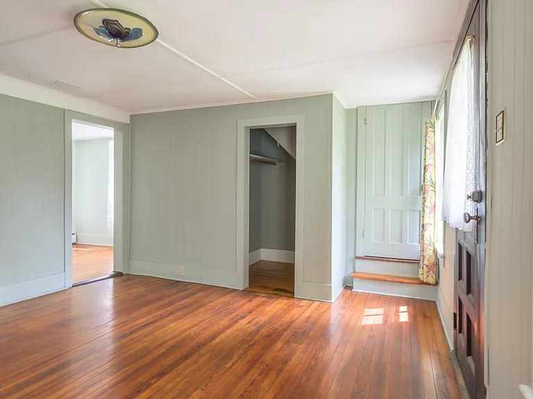 Three professional photos made pre-improvements on a less dreary day give better sense of scale and light in living room.