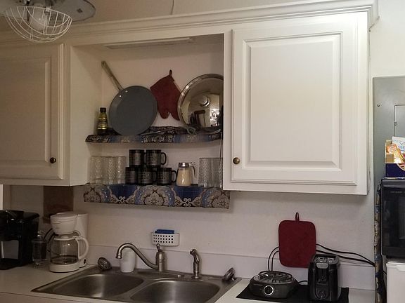 Kitchenette - Furnishings and fixtures are NOT included in the lease. Upper and lower cabinets provide plenty of room for your kitchen needs. This picture shows how nicely one of our tenants decorated the kitchen area making great use of that part of