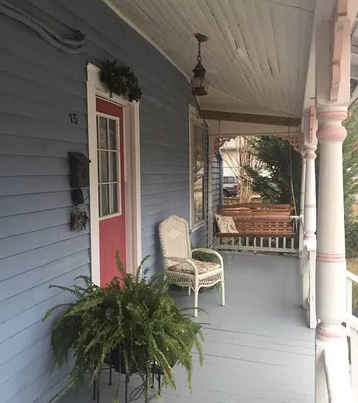 Covered front porch with swing