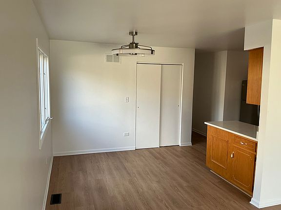 Kitchen eat-in area with new LED lighting and fan.