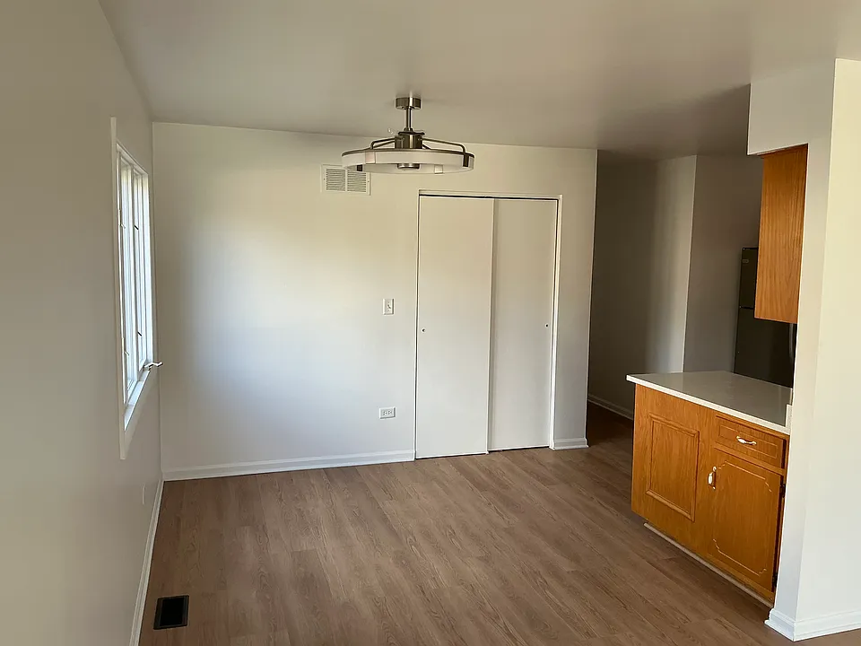 Kitchen eat-in area with new LED lighting and fan.