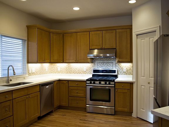 Updated kitchen with SS appliances and quartz counter top.