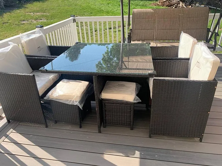 Private outdoor deck with railing and a patio dining set, offering an easy spot for meals, coffee, and fresh air.