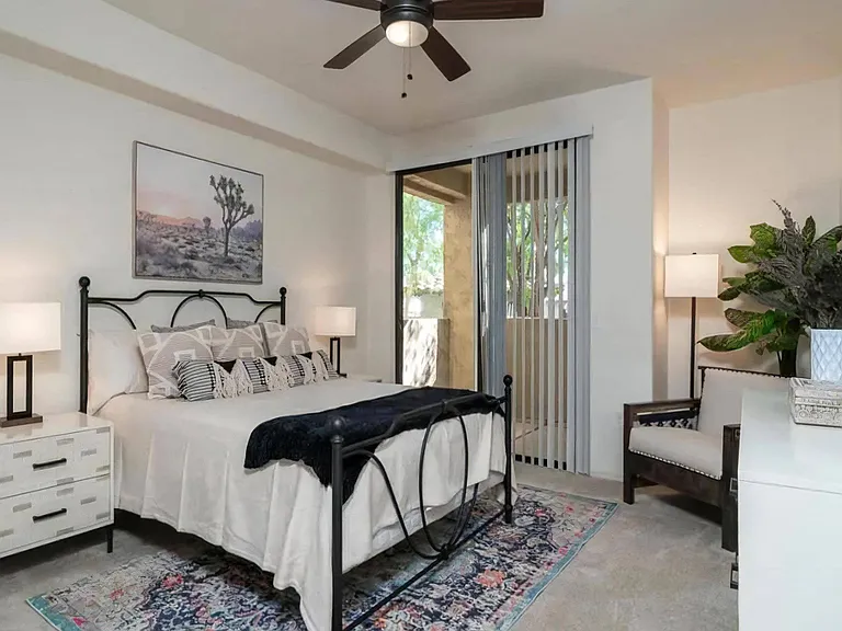 Spacious Bedroom with Patio Access and Ceiling Fan