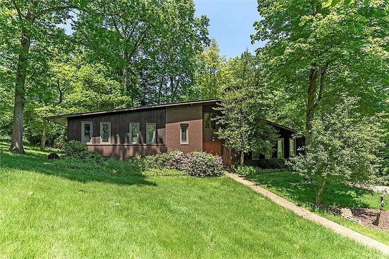 Amazing Privacy in Thisl Mid-Century Modern on a RARE 1 Acre Lot Backing to Holes 5/6 of the Montour Heights Country Club