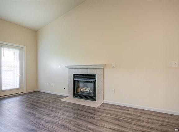 Vaulted ceilings and a cozy gas fireplace are top floor feat
