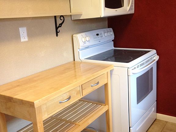 kitchen with stove, microwave
