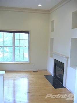 Living Room w/Fireplace & Hardwood Flooring