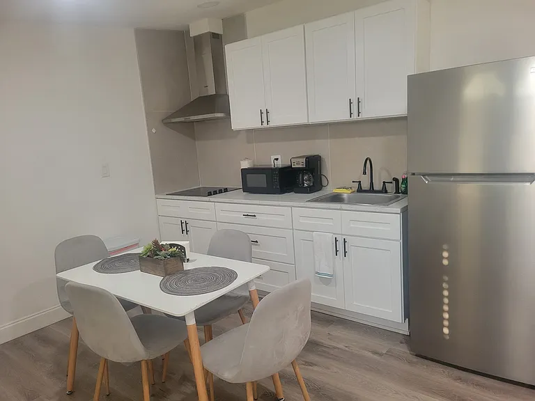charming dining room and kitchen with refrigerator and essential amenities