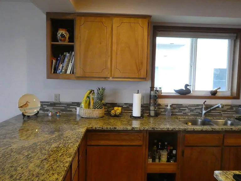 Kitchen comes fully stocked with dishes and cookware.