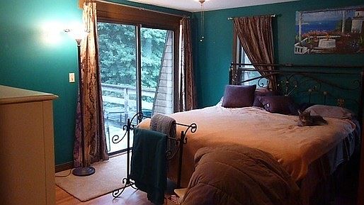 Master bedroom with sliders to deck