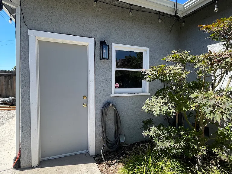 Door to garage from backyard