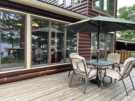 Large deck, patio table and chairs (yes we have extra chairs not shown) Wow! Do you notice the custom carved outdoor bar?