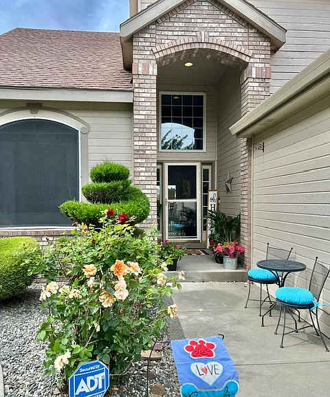 Enjoy the rose bushes and custom landscaping.