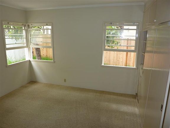 Bedroom with built ins and large closet