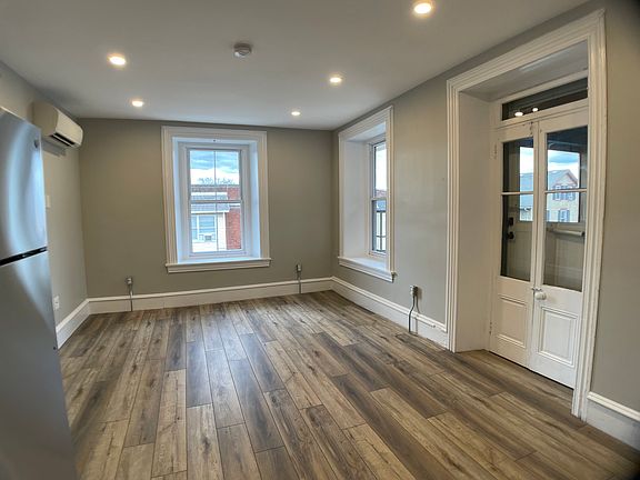Large windows. Door accesses side porch.