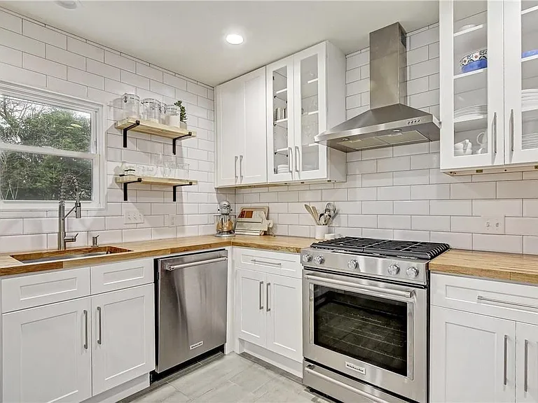 Updated Kitchen with New Appliances, Butcher Block Counter tops, Great Storage, Floating Shelves, Gas Range