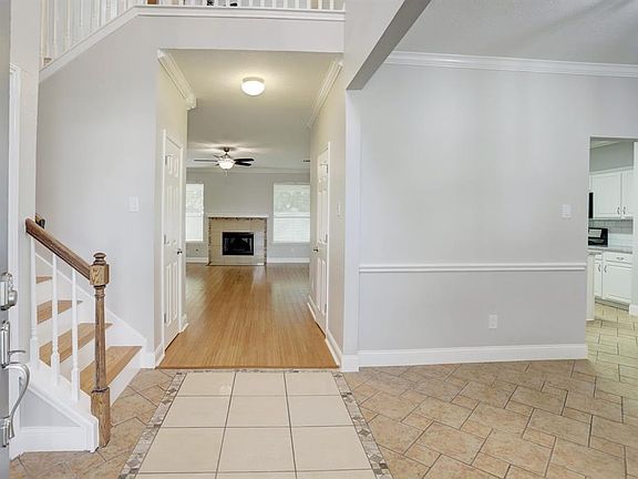 Entry into home. Refreshed and energized this home is ready to go. Crown molding has been added to all living spaces down and designer width baseboards added for the complete elegance!