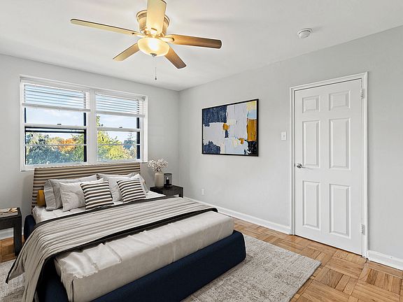Experience true comfort in this tastefully designed bedroom with ample natural light.