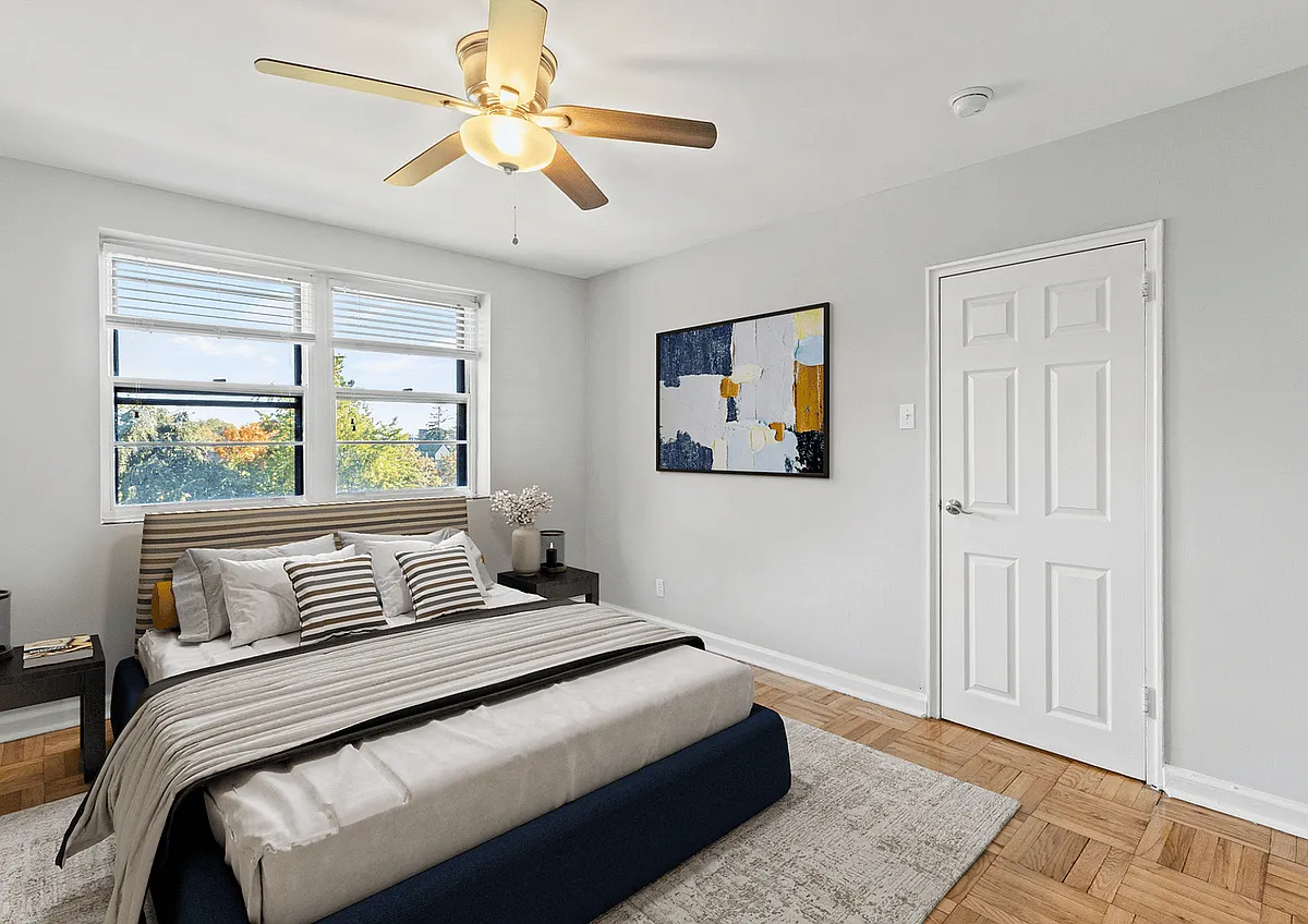 Experience true comfort in this tastefully designed bedroom with ample natural light. - Pelham Park