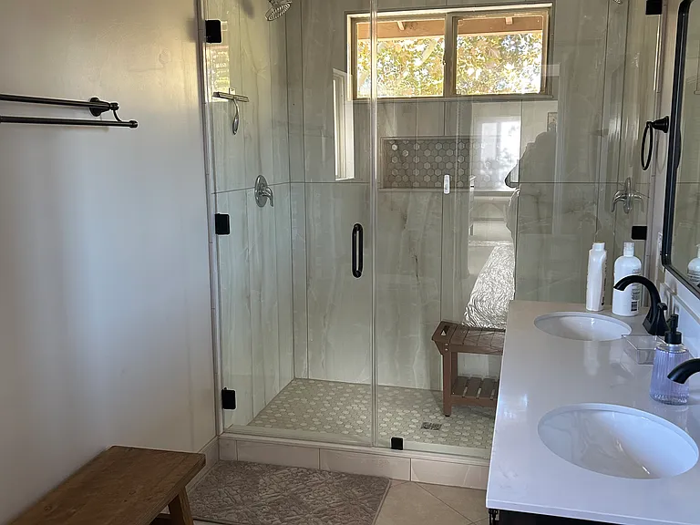 Completely redone bathroom with walk in shower (with stool!)