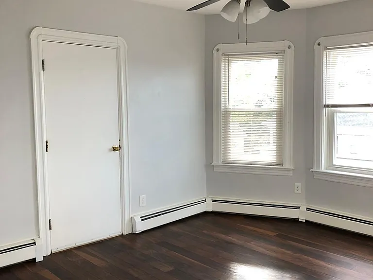Living room with walk-in closet.