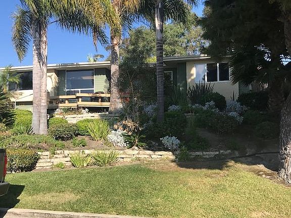 Front deck and yard -- left windows are family room ocean views and on right is master bdrm window