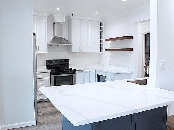 Kitchen with quartz counters/updated appliances