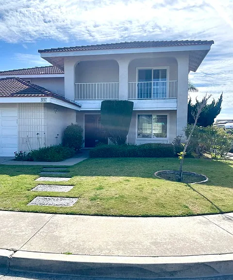 Front of house; corner lot. Gardening provided by owners.